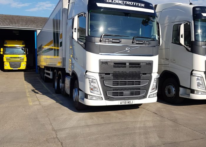 A white lorry parked up outside of a driver CPC training school