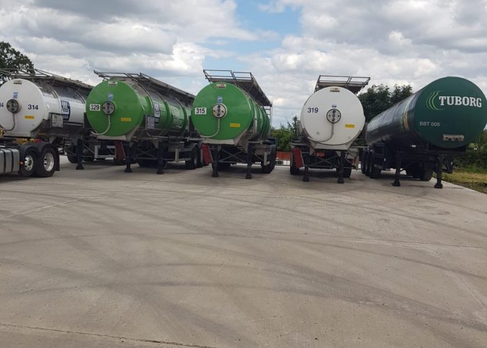 A row of trailers lined up besides a CPC driver training school